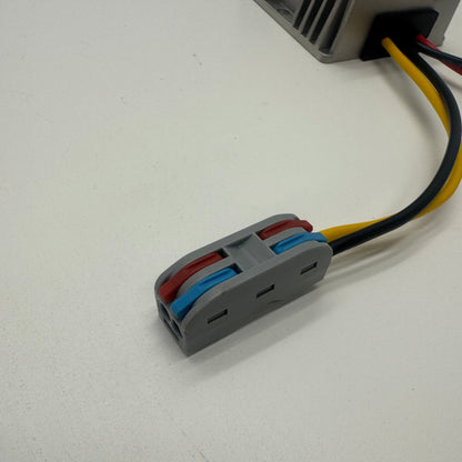 Close-up of the wire connector on the 12V to 15V DC-DC converter