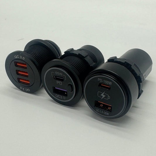 Angled view of 12V USB chargers showing triple USB-A, 65W USB-C PD and 100W USB-C PD options