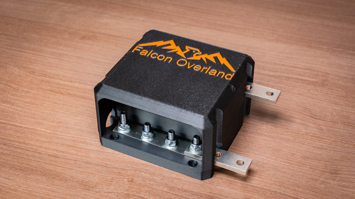 Falcon 4-way 12V power distribution block with cover fitted and four terminal studs visible