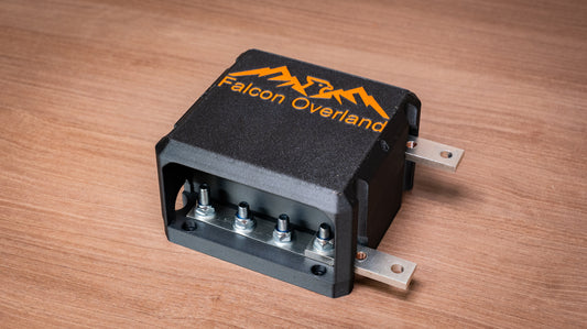 Falcon 4-way 12V power distribution block with cover fitted and four terminal studs visible
