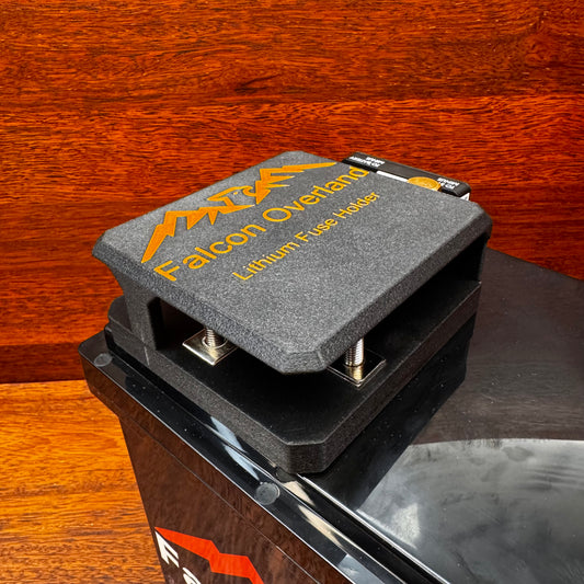 Falcon 6-way lithium battery fuse block mounted on a battery with its lid fitted