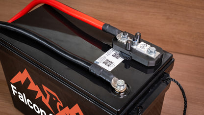 Lithium battery fuse in an uncovered holder on a Falcon battery, connected to red and black cables