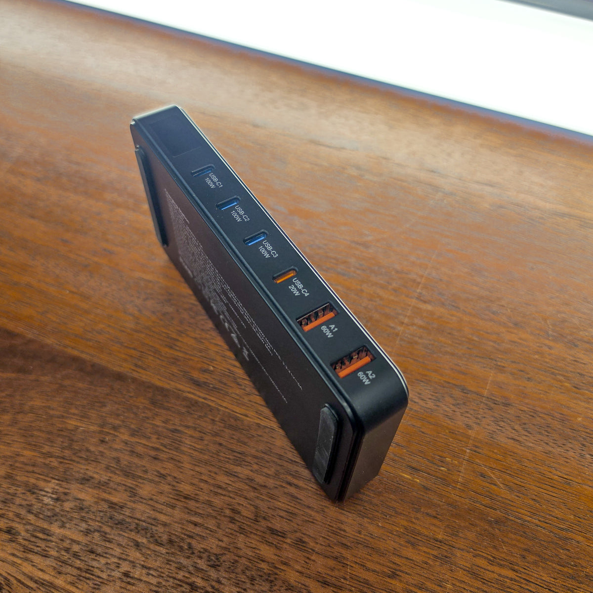 Falcon Overland 175W USB charging hub standing on its edge, showing USB-C and USB-A ports and the underside label.