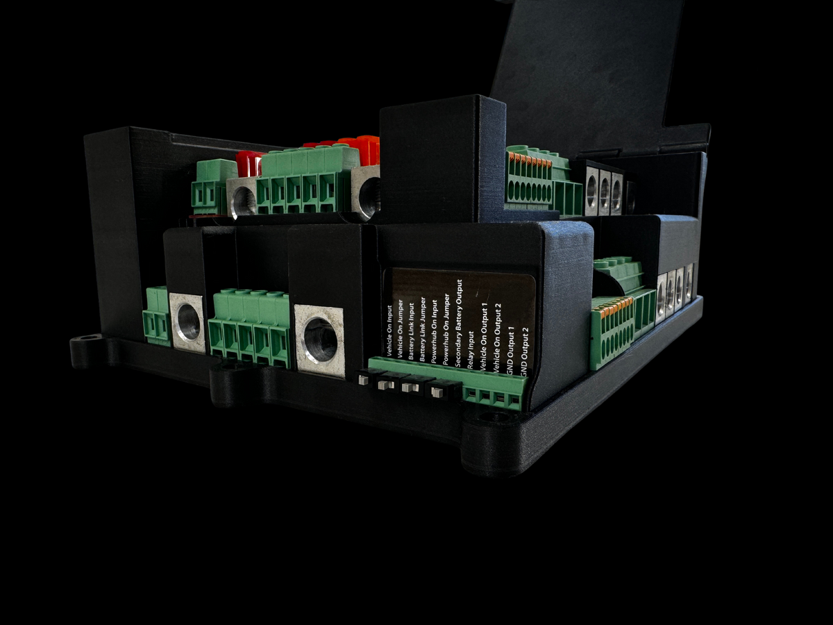 Giga Power Hub 12V power distribution system with cover open, showing side connectors and printed connection labels