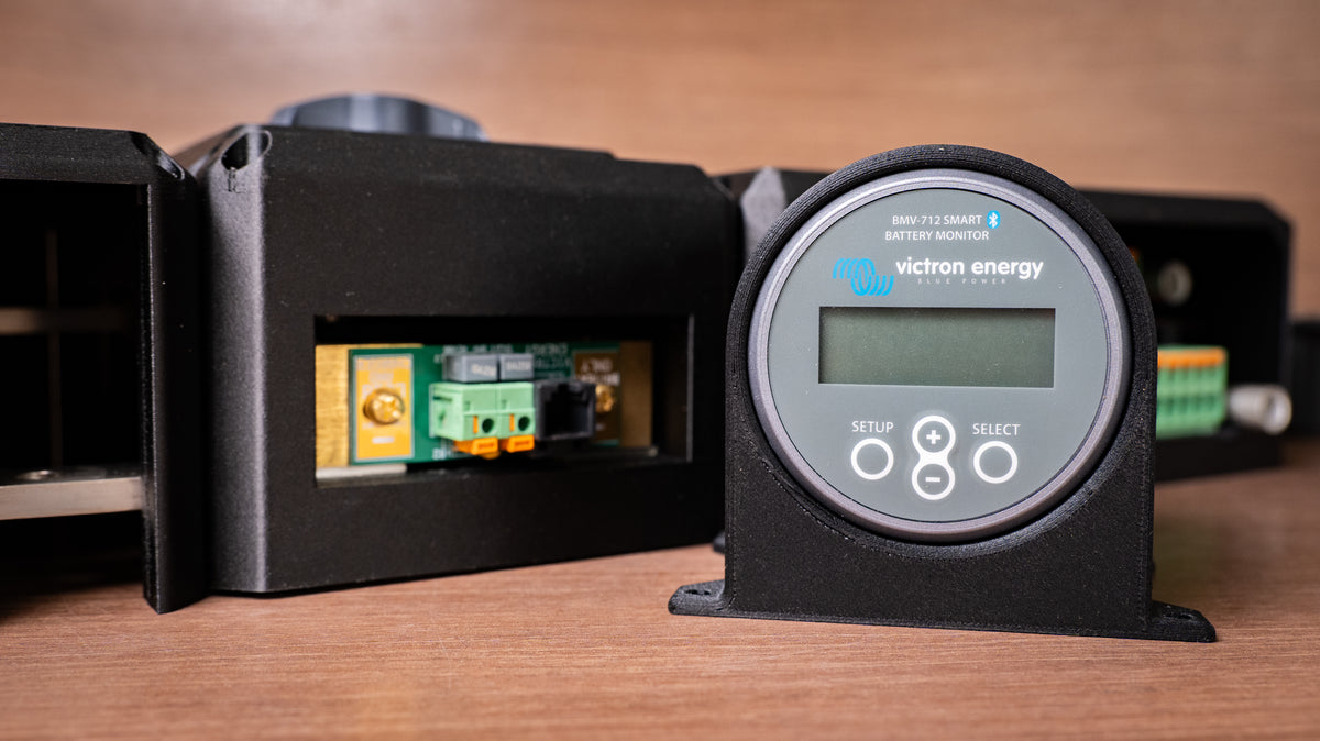 Front view of the black Victron battery monitor holder fitted with a BMV-712 Smart monitor